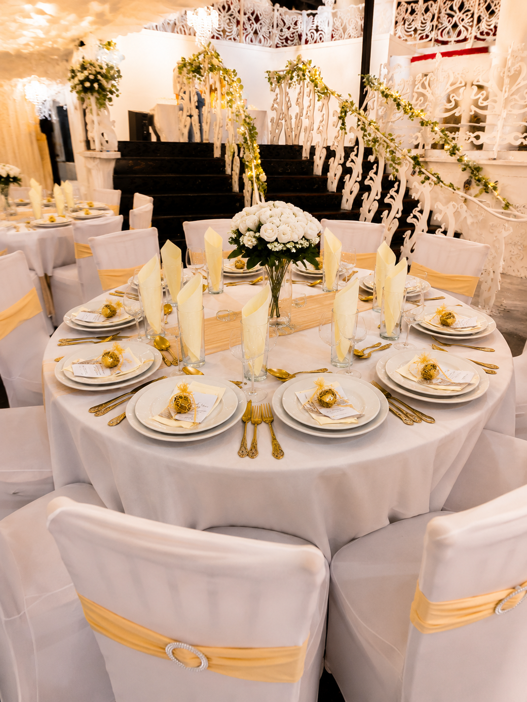 Civil wedding reception at Opulent @ 35 Liverpool with a sweeping staircase entrance and banquet tablescape
